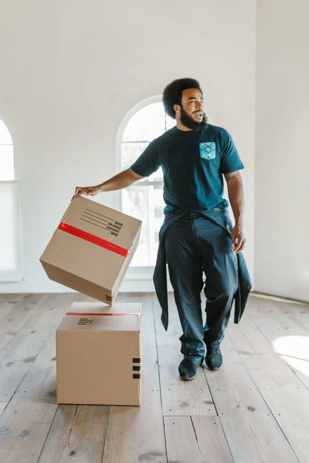 A mover carrying a packed carton